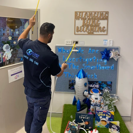 Commercial electrician installing additional power outlets for a childcare centre