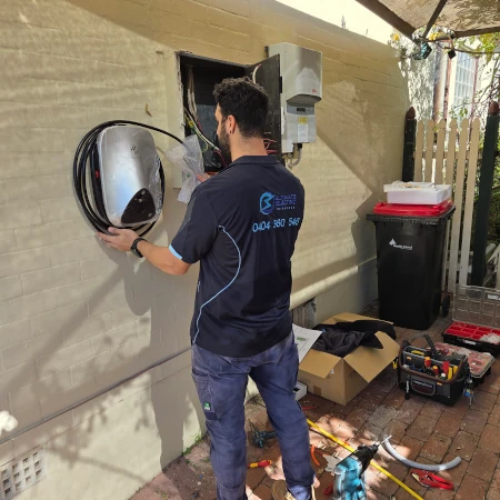 Electrician installing MG ChargeHub