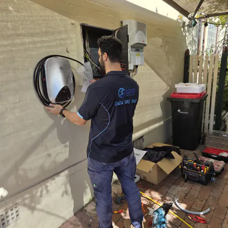 Electrician installing MG ChargeHub