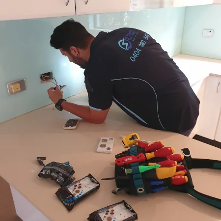 Electrician installing Clipsal Iconic Double Power Points in a residential space