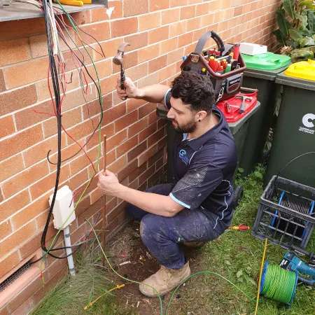 Electrician Installing An Earth Rod